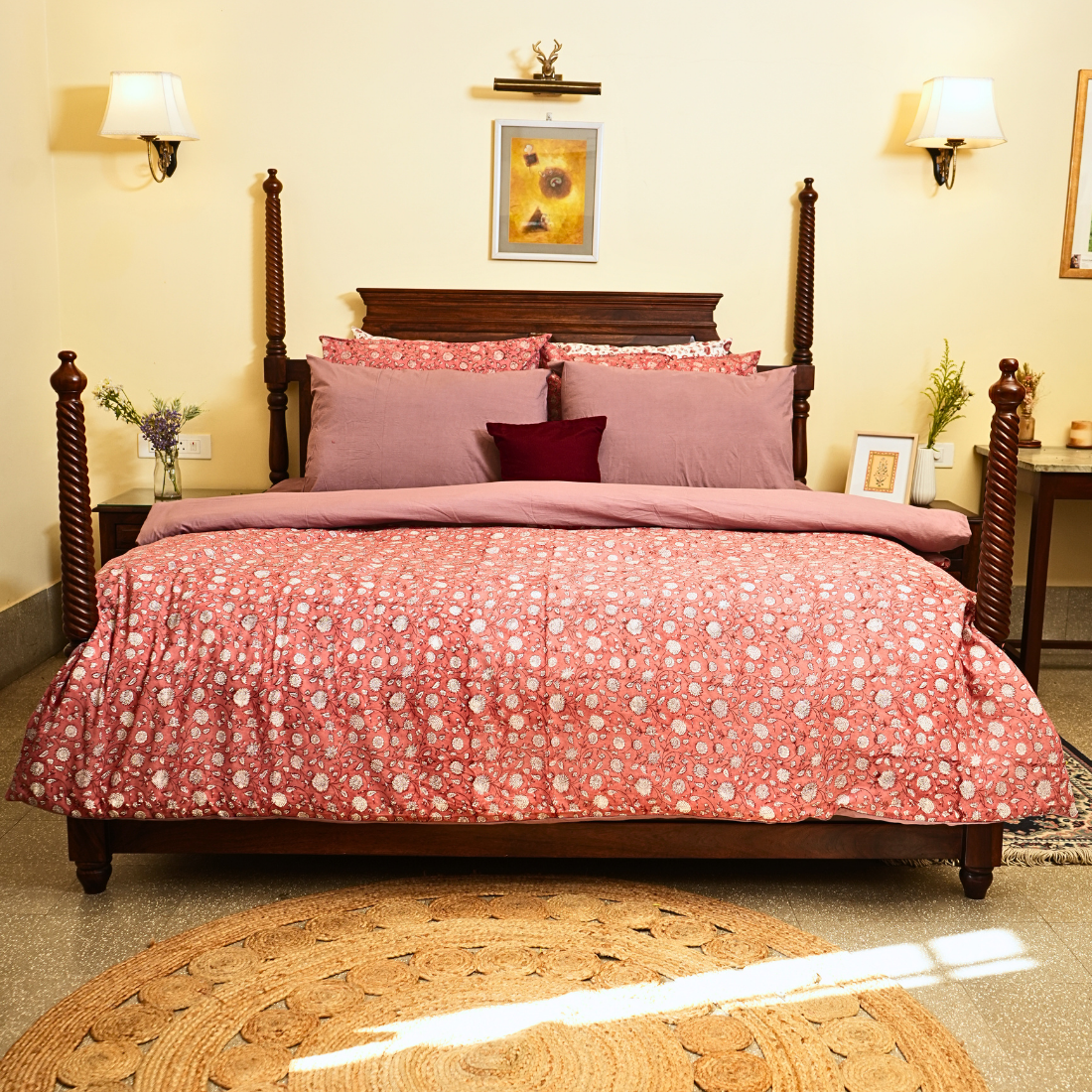 Bedroom with a bed covered in pink floral bedding