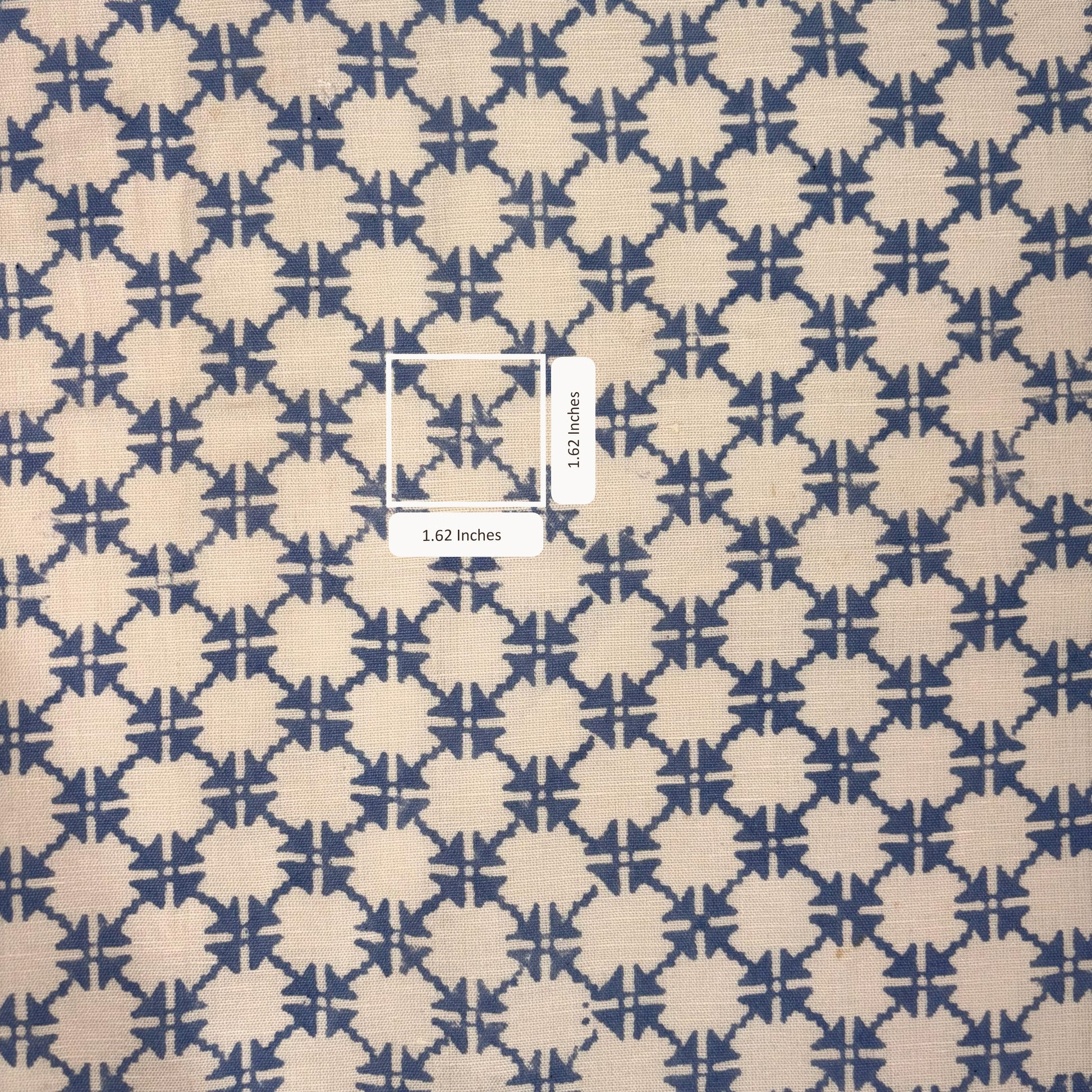 Patterned fabric with a geometric design on a beige and blue background