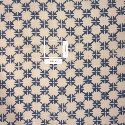 Patterned fabric with a geometric design on a beige and blue background