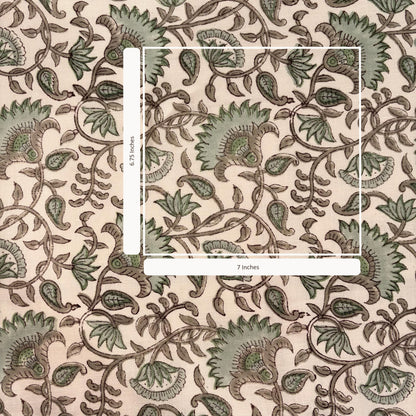 Decorative paper with intricate green floral pattern on a beige background