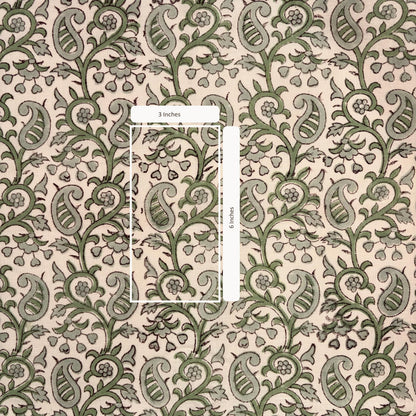 Patterned fabric with green and beige design, featuring a measurement overlay.