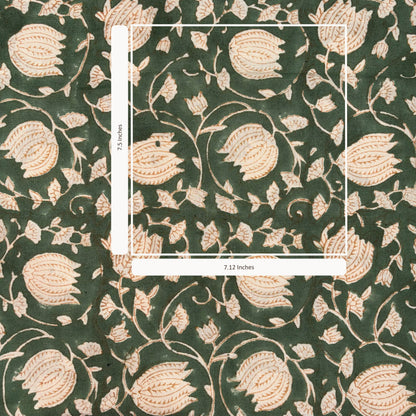 Floral patterned fabric with a scale bar on a green background