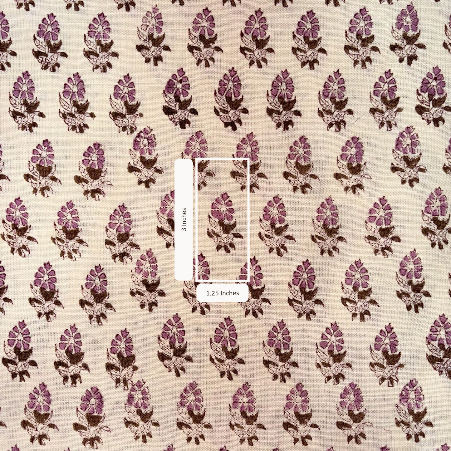 Patterned fabric with pink and brown design on a beige background
