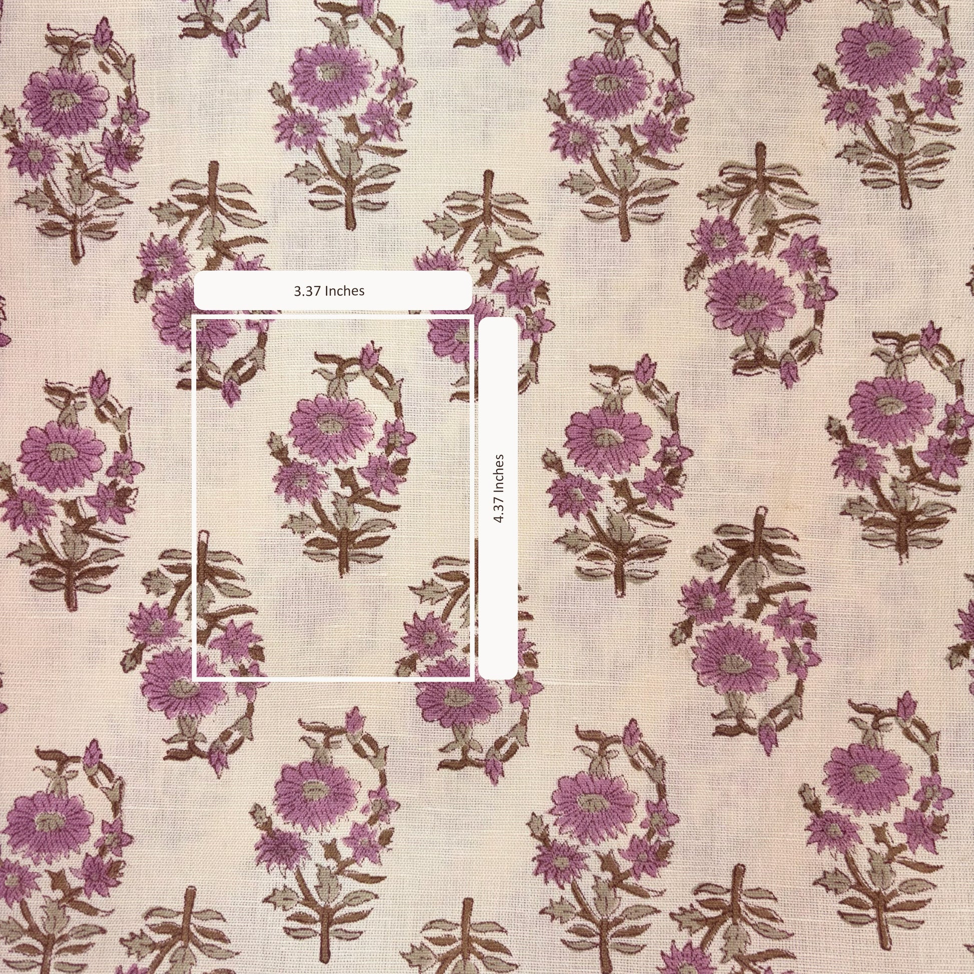 Floral patterned fabric with a ruler for scale on a beige background