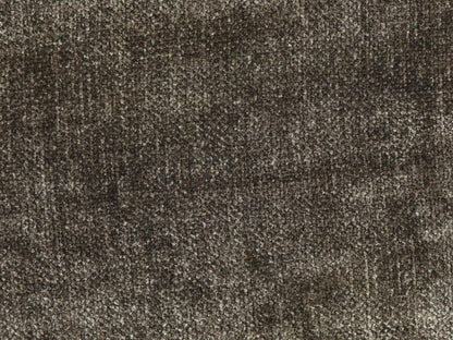 Close-up of a textured brown fabric surface
