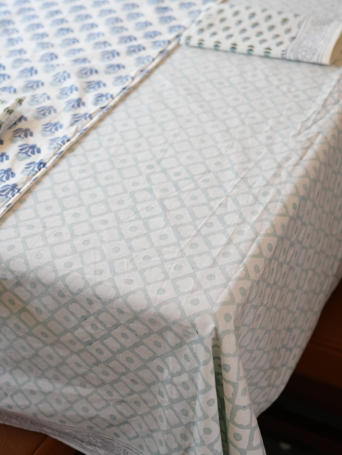 Close-up of a tablecloth with geometric pattern on a wooden surface
