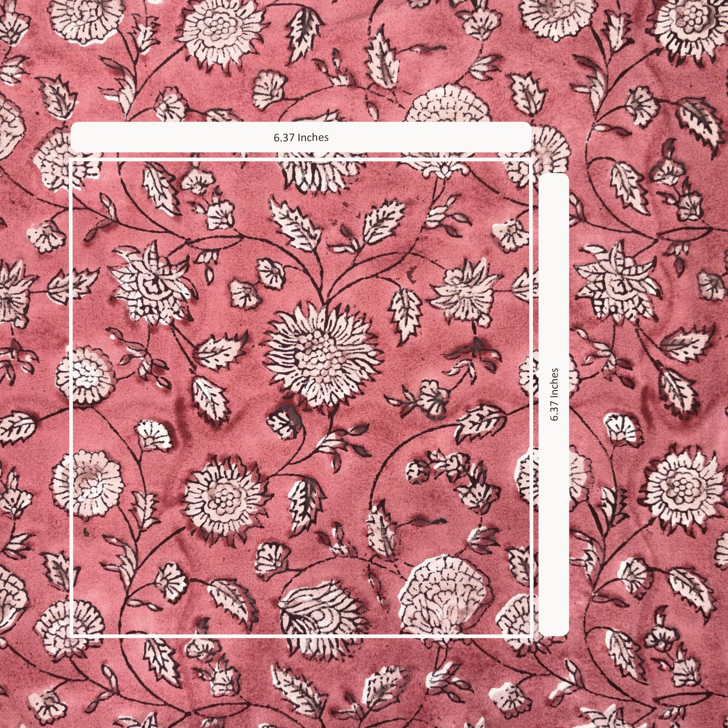 Floral patterned fabric with measurements on a pink background