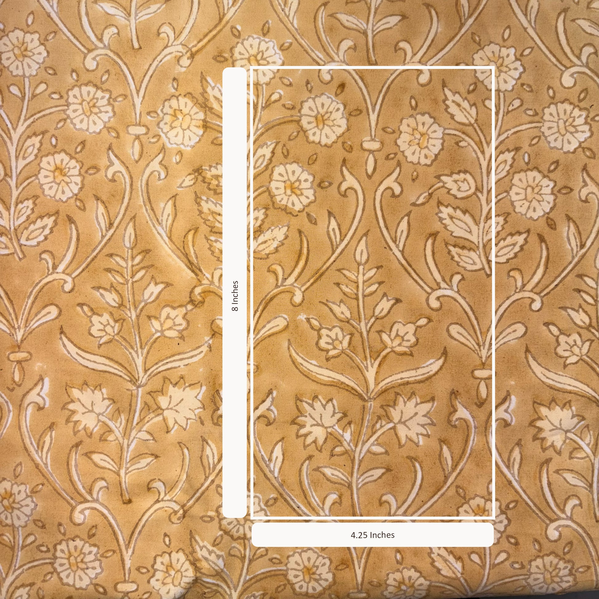 Floral patterned fabric with a scale bar indicating dimensions.