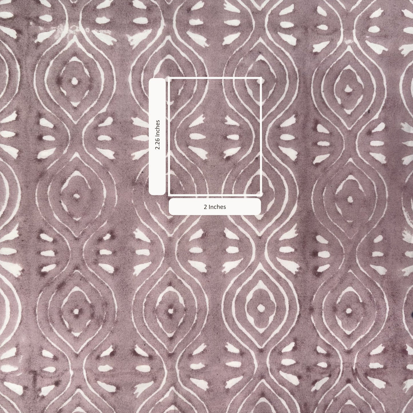 Patterned fabric with a measurement overlay on a pink background