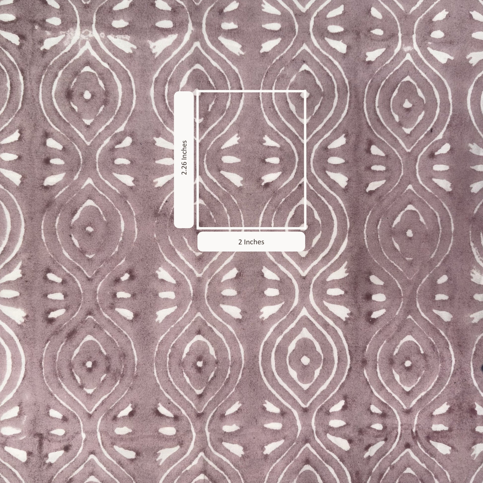 Patterned fabric with a measurement overlay on a pink background
