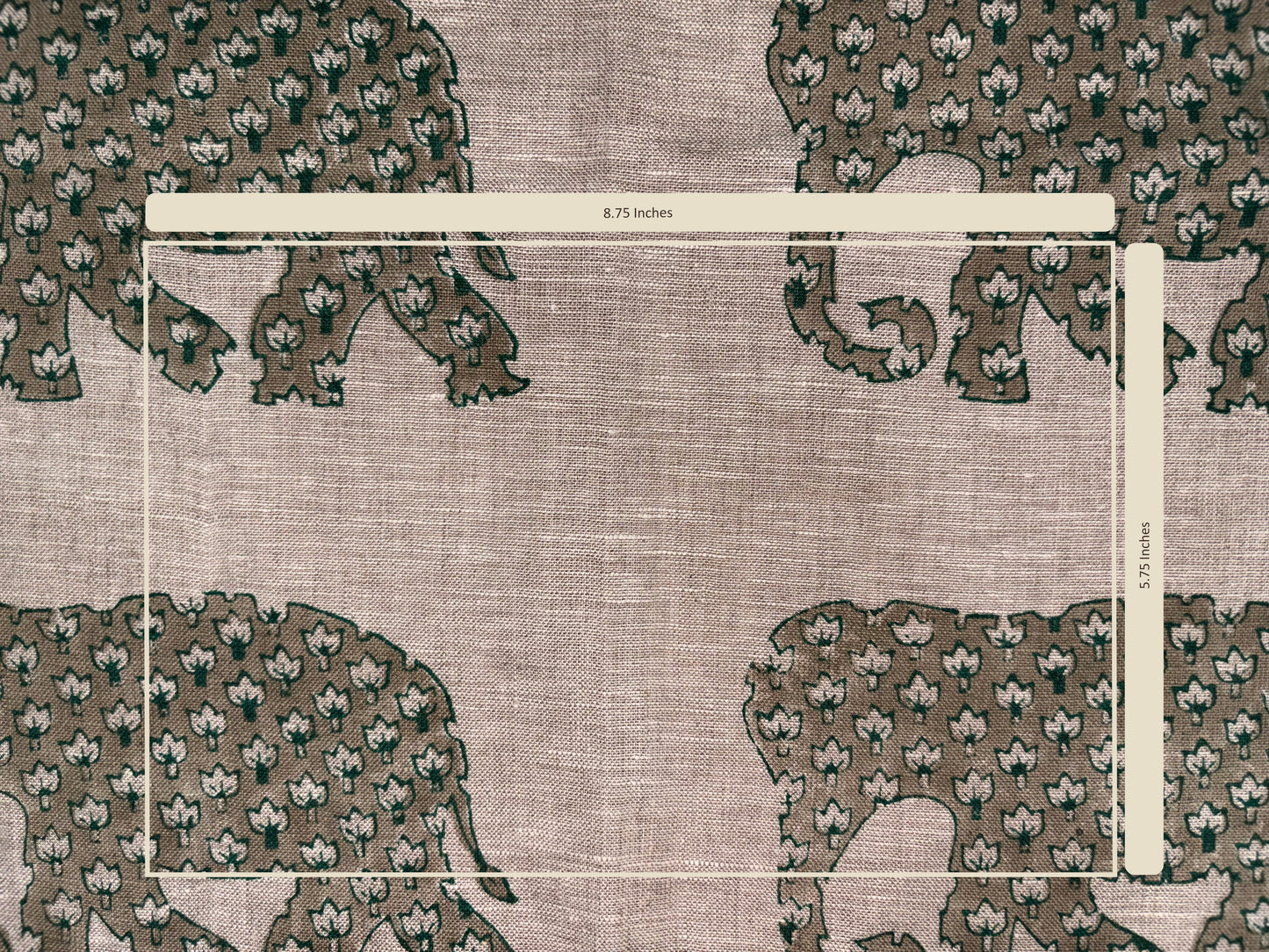 Textile with floral pattern and measurement scale on a grey background