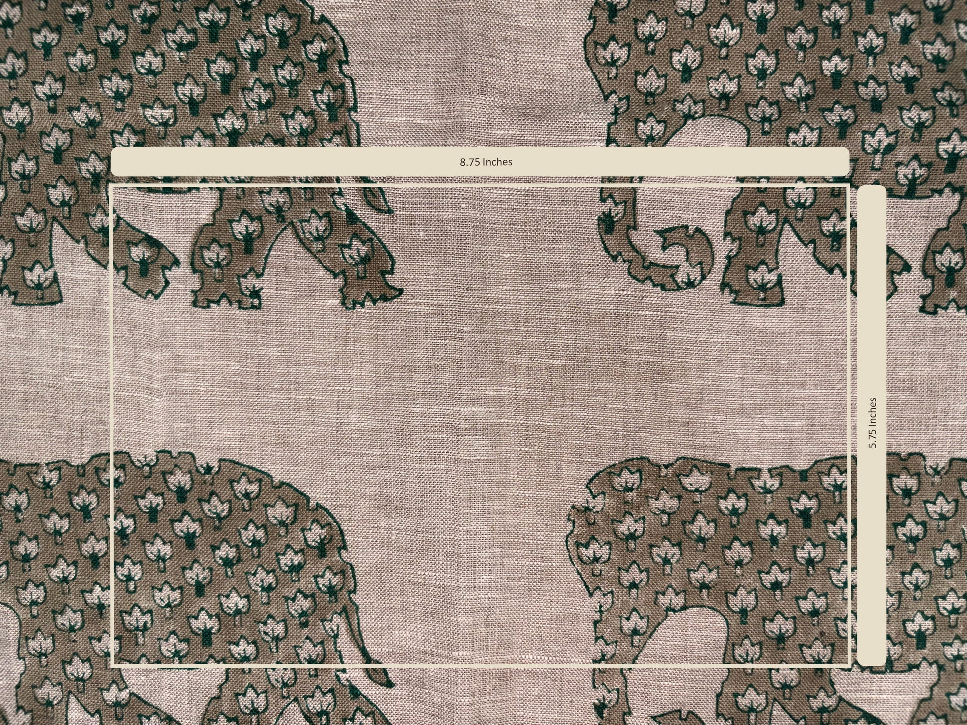 Textile with floral pattern and measurement scale on a grey background