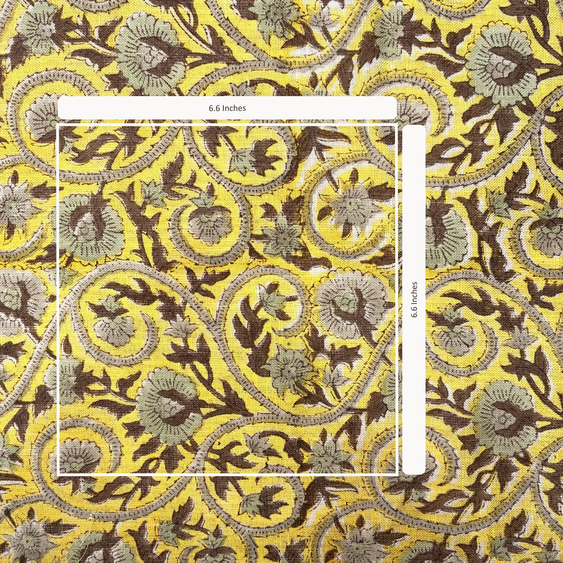 Decorative fabric with intricate floral and paisley pattern on a yellow background
