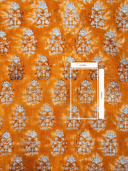 Patterned fabric with floral design on an orange background
