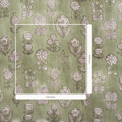 Floral patterned fabric with a ruler for scale on a green background