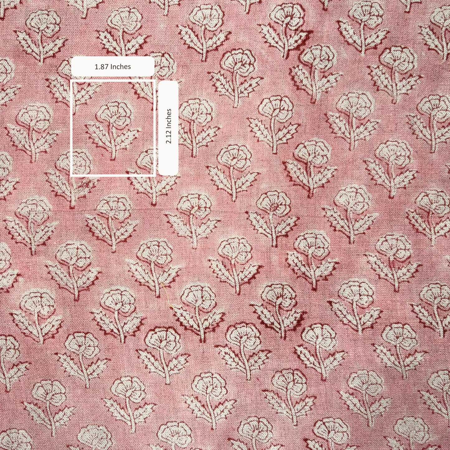 Floral patterned fabric with measurements on a pink background