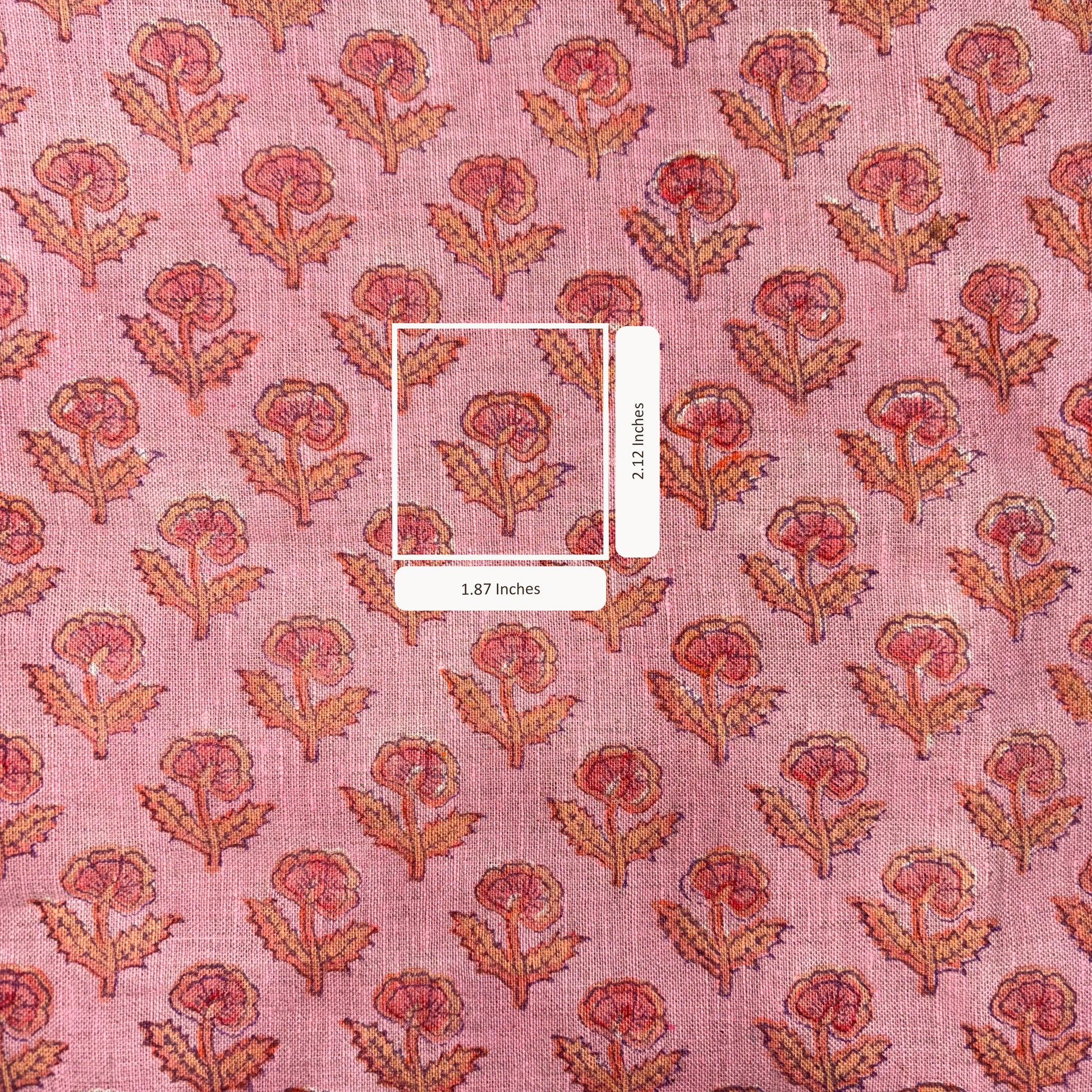 Pink fabric with floral pattern and measurement label
