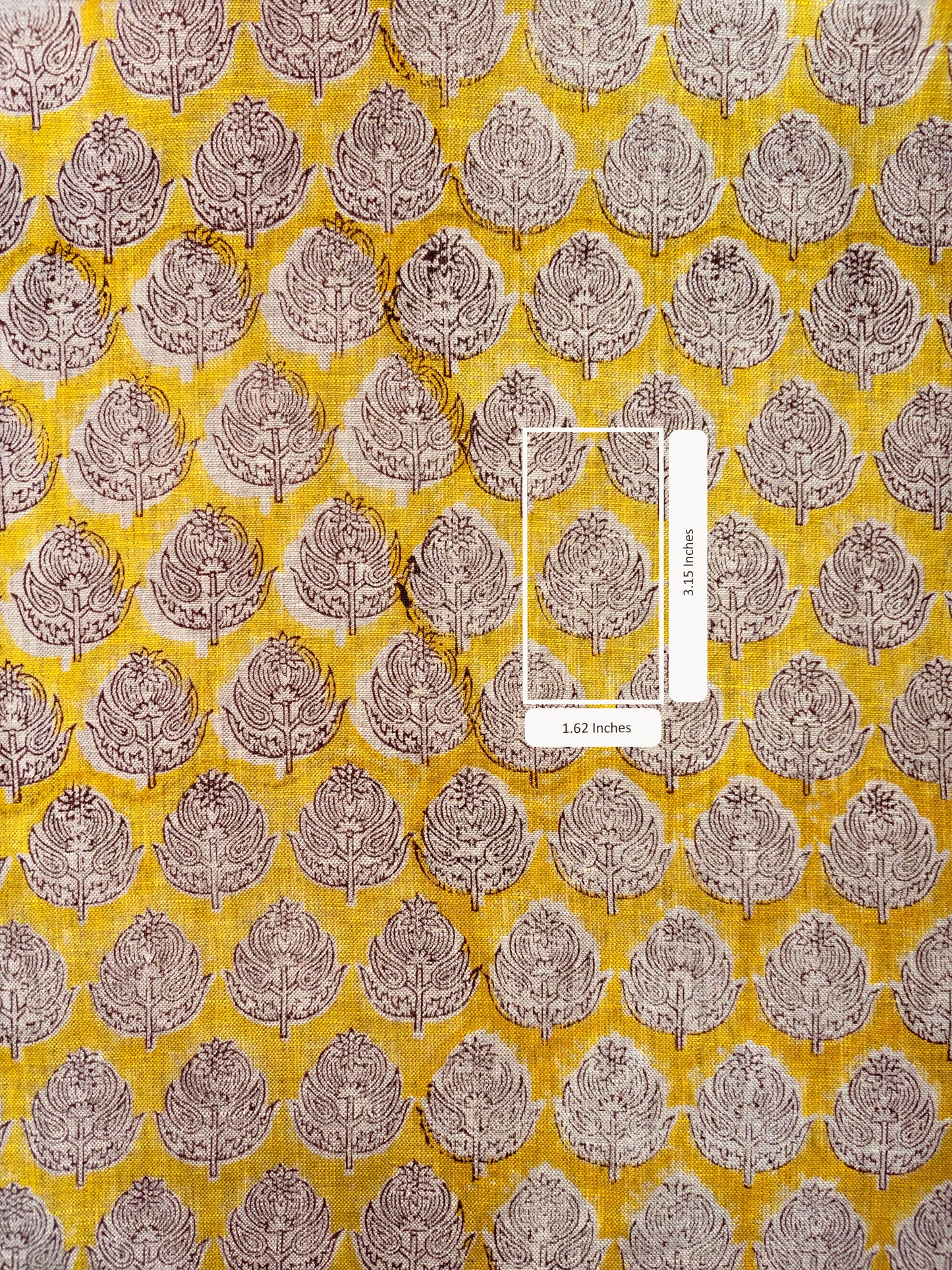 Fabric with a leaf pattern on a yellow background