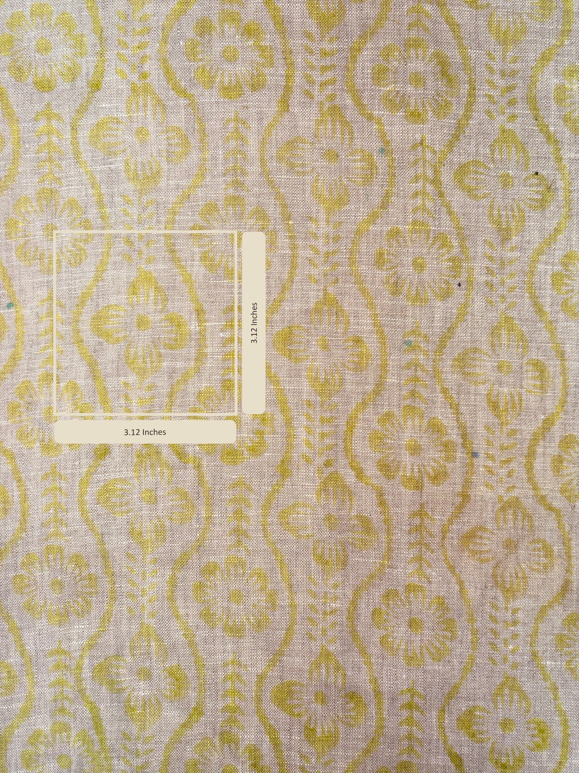 Patterned fabric with yellow and grey design on a textured background