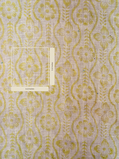 Patterned fabric with yellow and grey design on a textured background