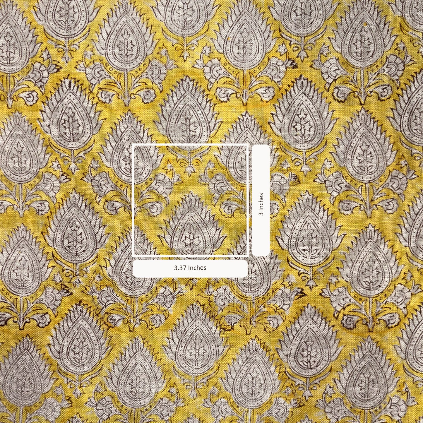 Fabric with yellow and gray paisley pattern with measurement scale