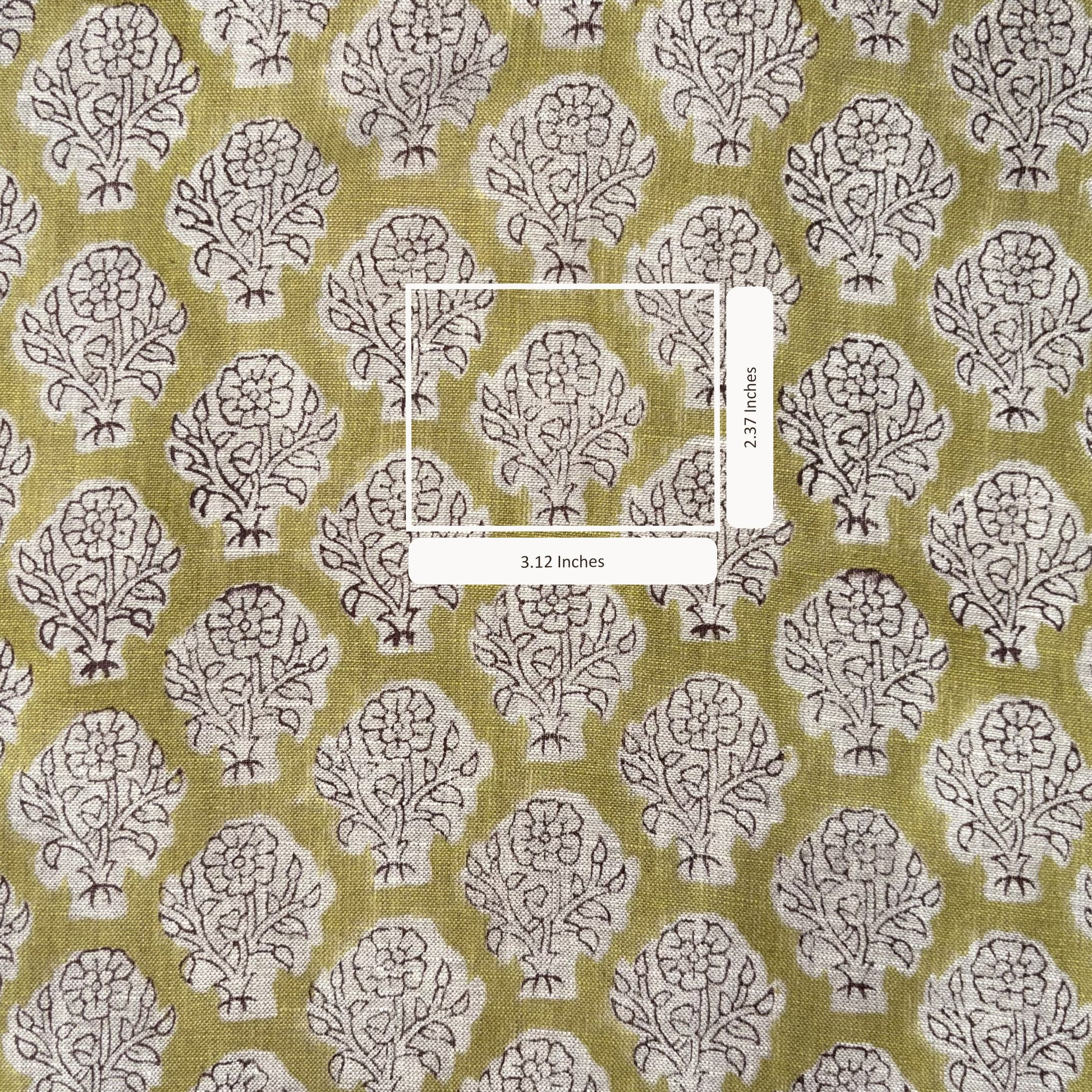 Fabric with a tree pattern and measurement label on a green background