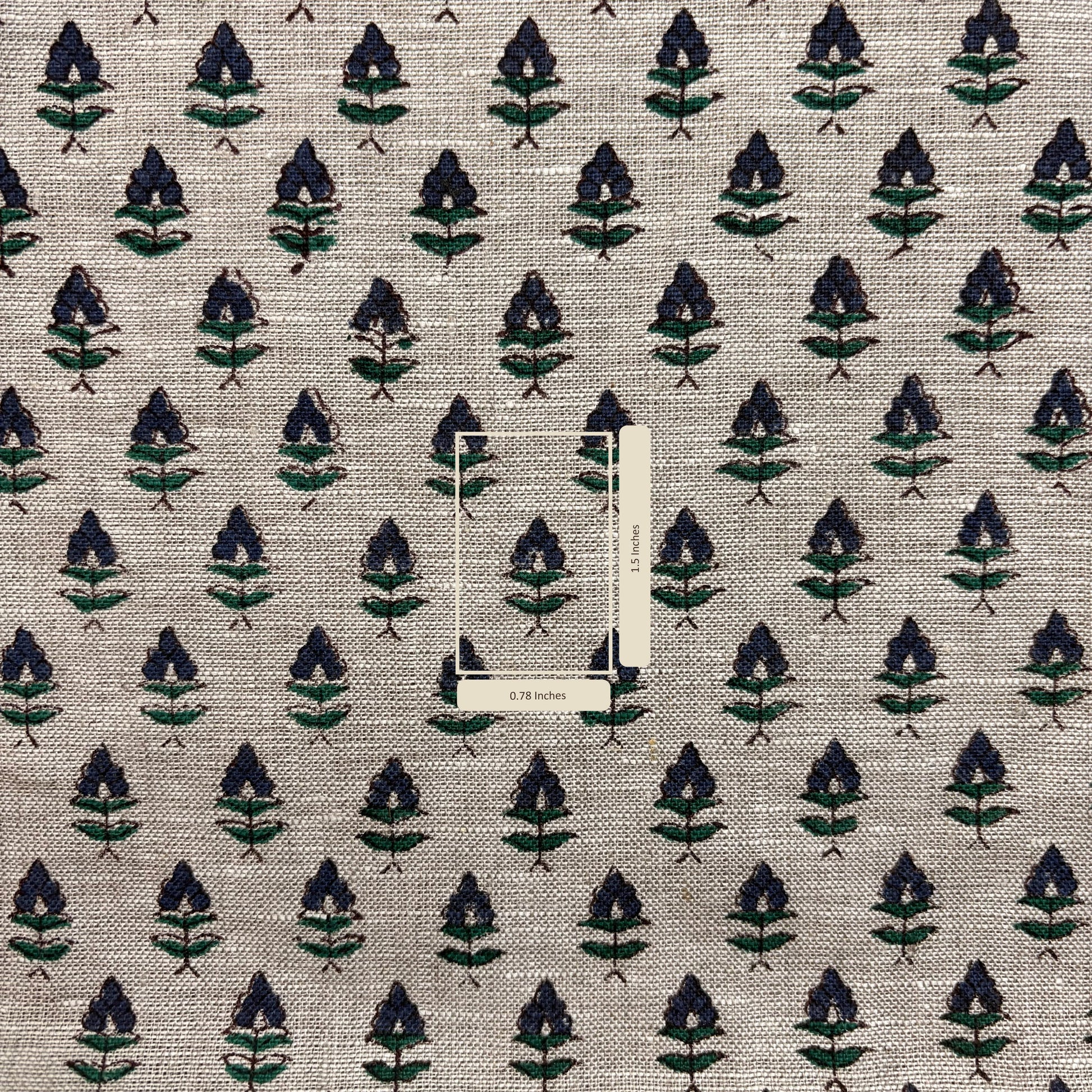Textile fabric with a leaf pattern on a grey background with measurement scale