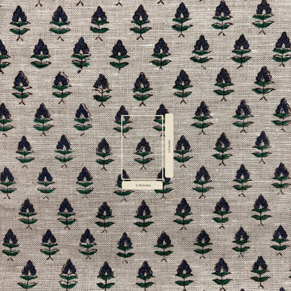Textile fabric with a leaf pattern on a grey background with measurement scale