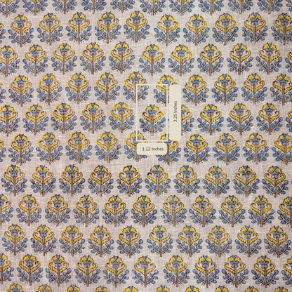 Patterned fabric with blue and yellow design on a grey background