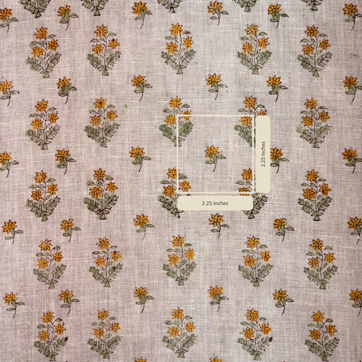 Floral patterned fabric with a measurement label on a grey background
