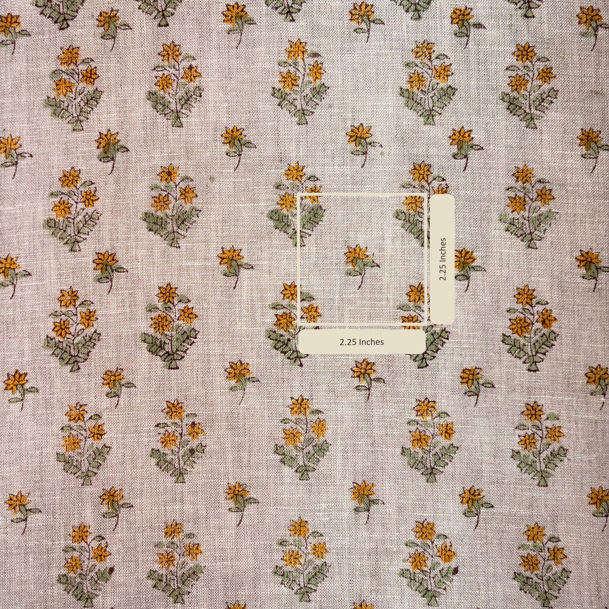 Floral patterned fabric with a measurement label on a grey background