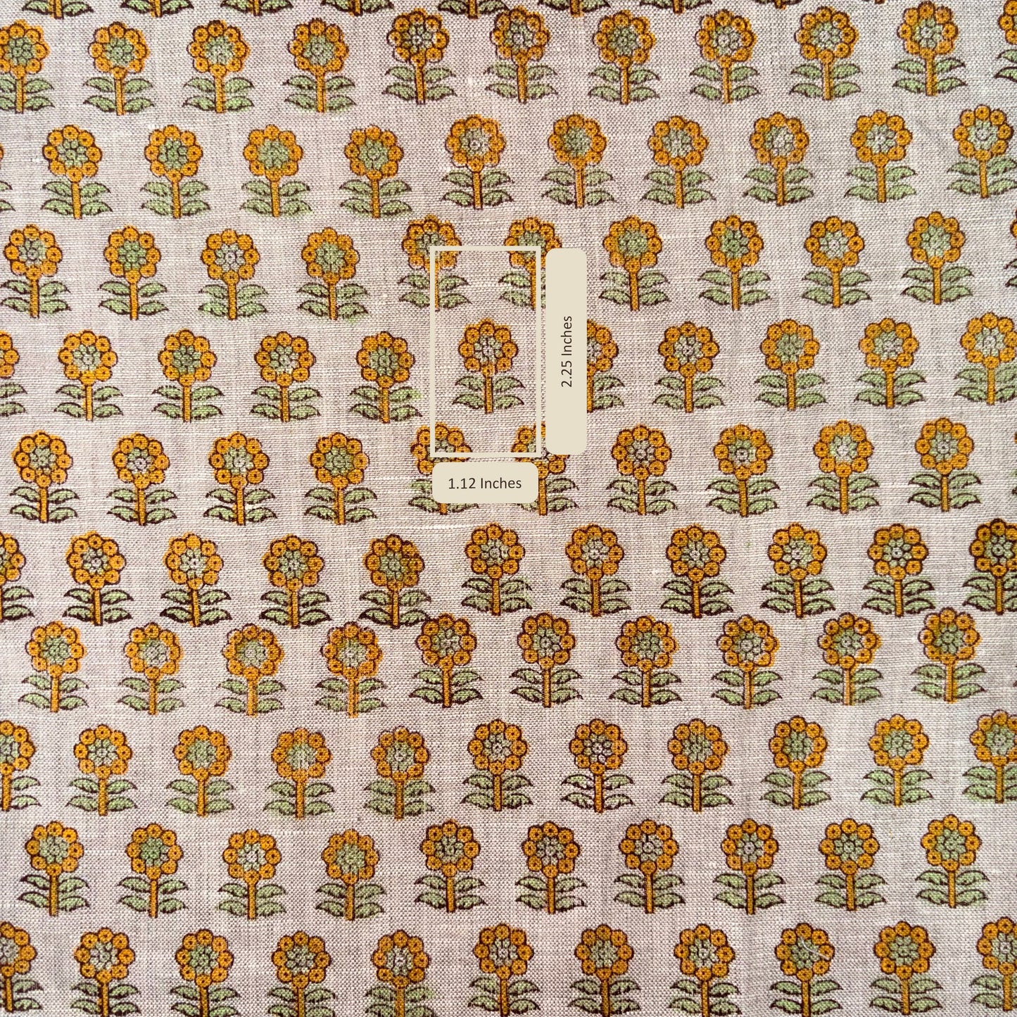 Patterned fabric with orange and green flowers on a grey background