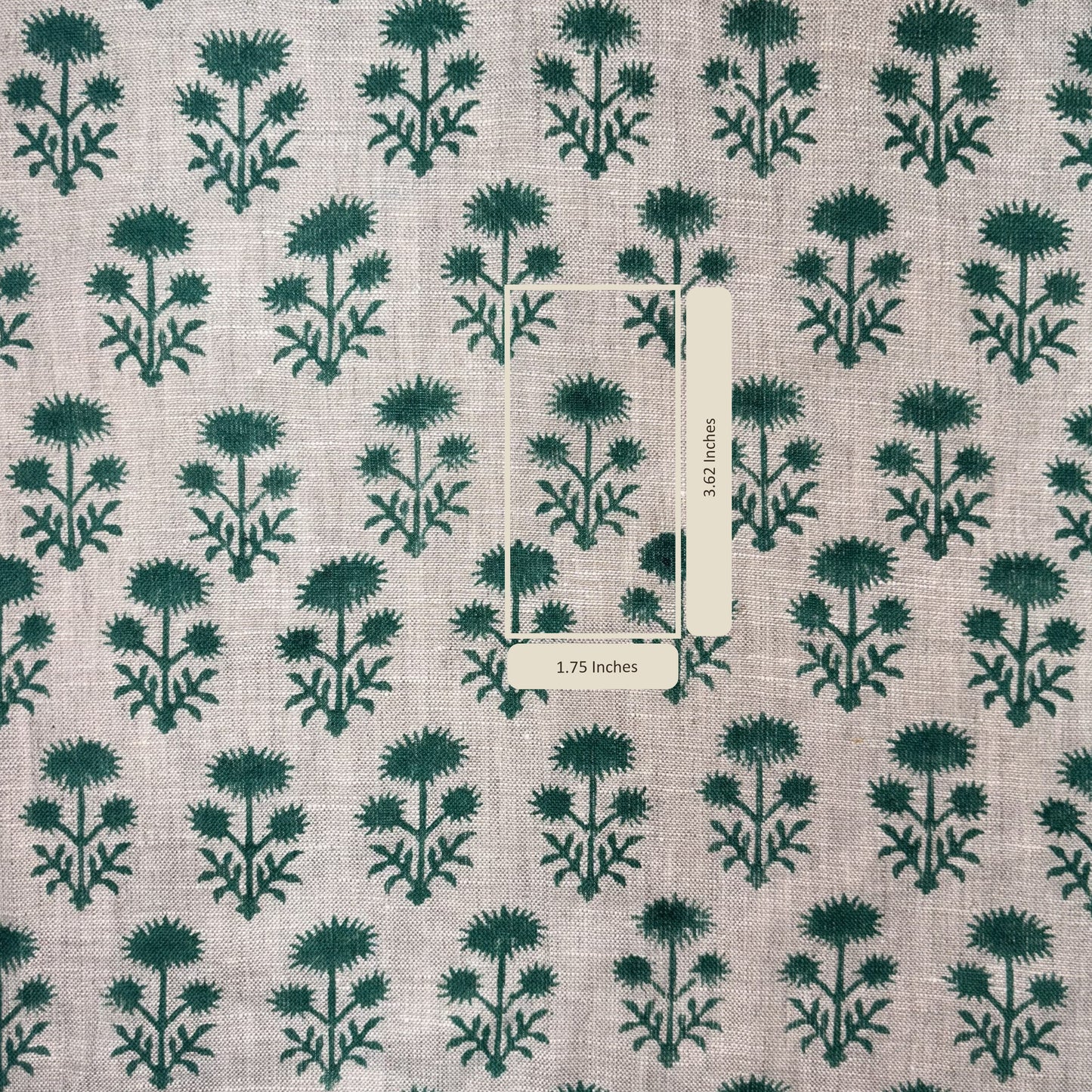 Patterned fabric with green floral design on grey background