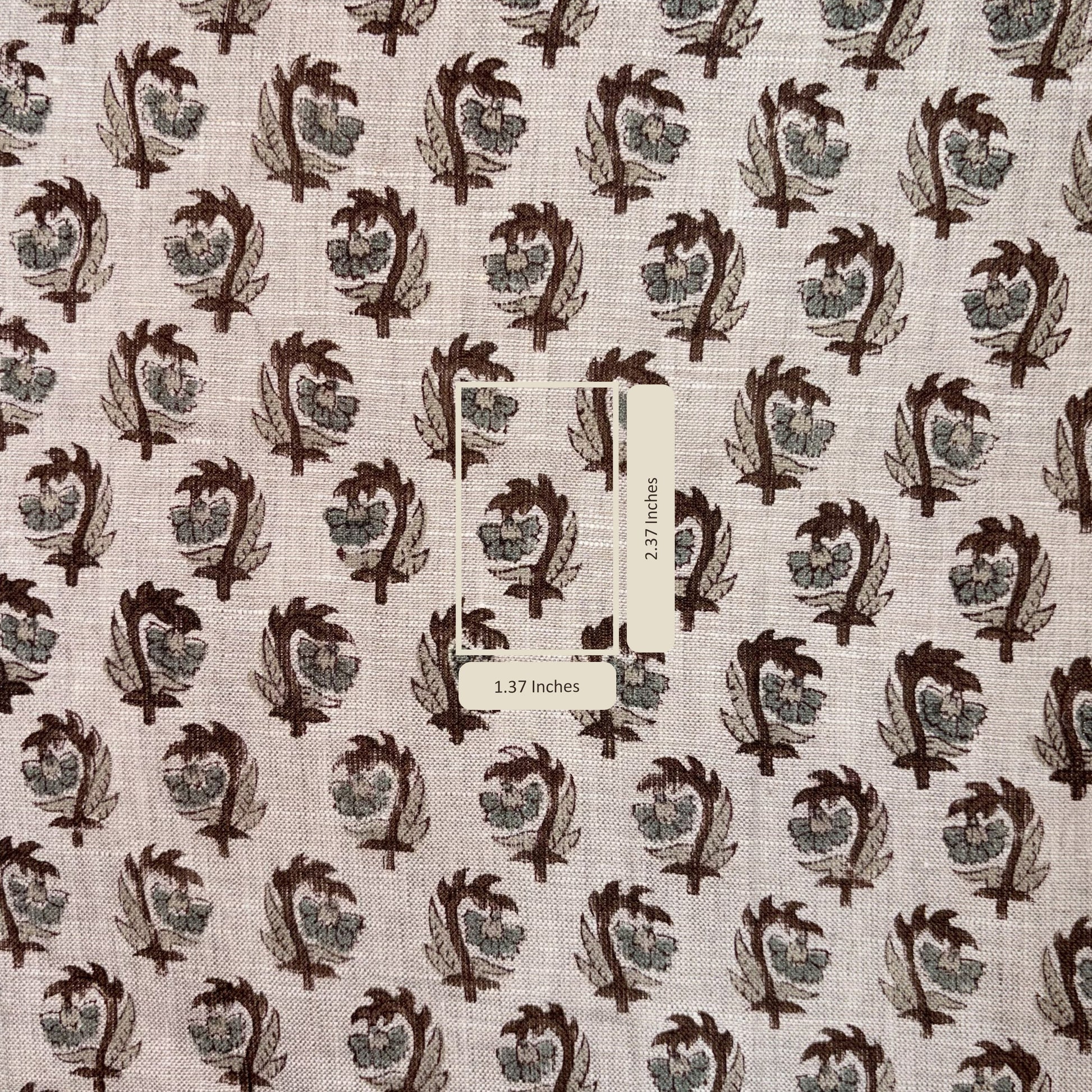 Fabric with a pattern of leaf-like shapes on a grey background, with a measurement label included.