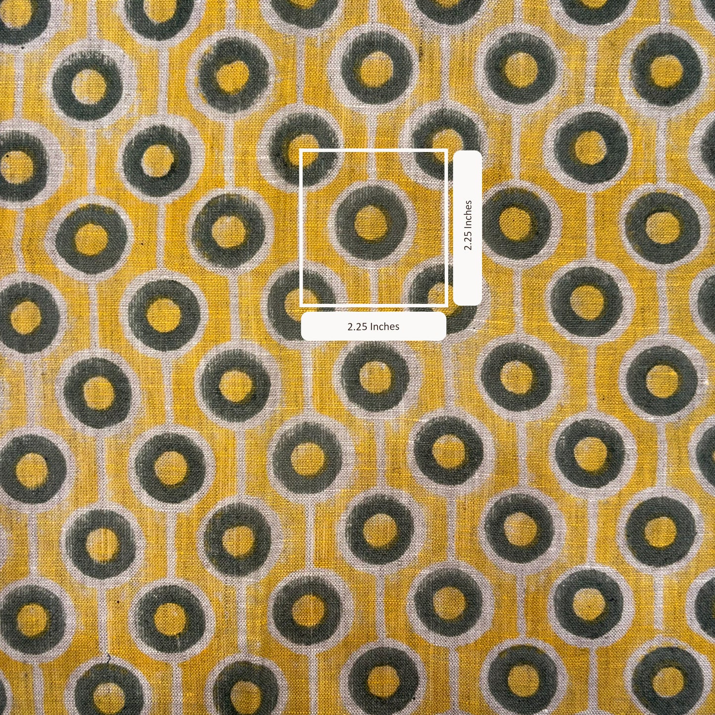 Patterned fabric with circular design on a yellow background