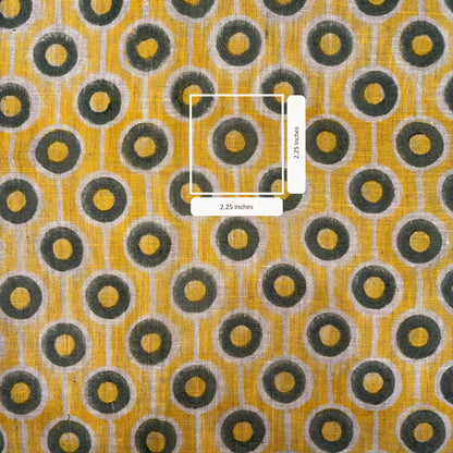 Patterned fabric with circular design on a yellow background
