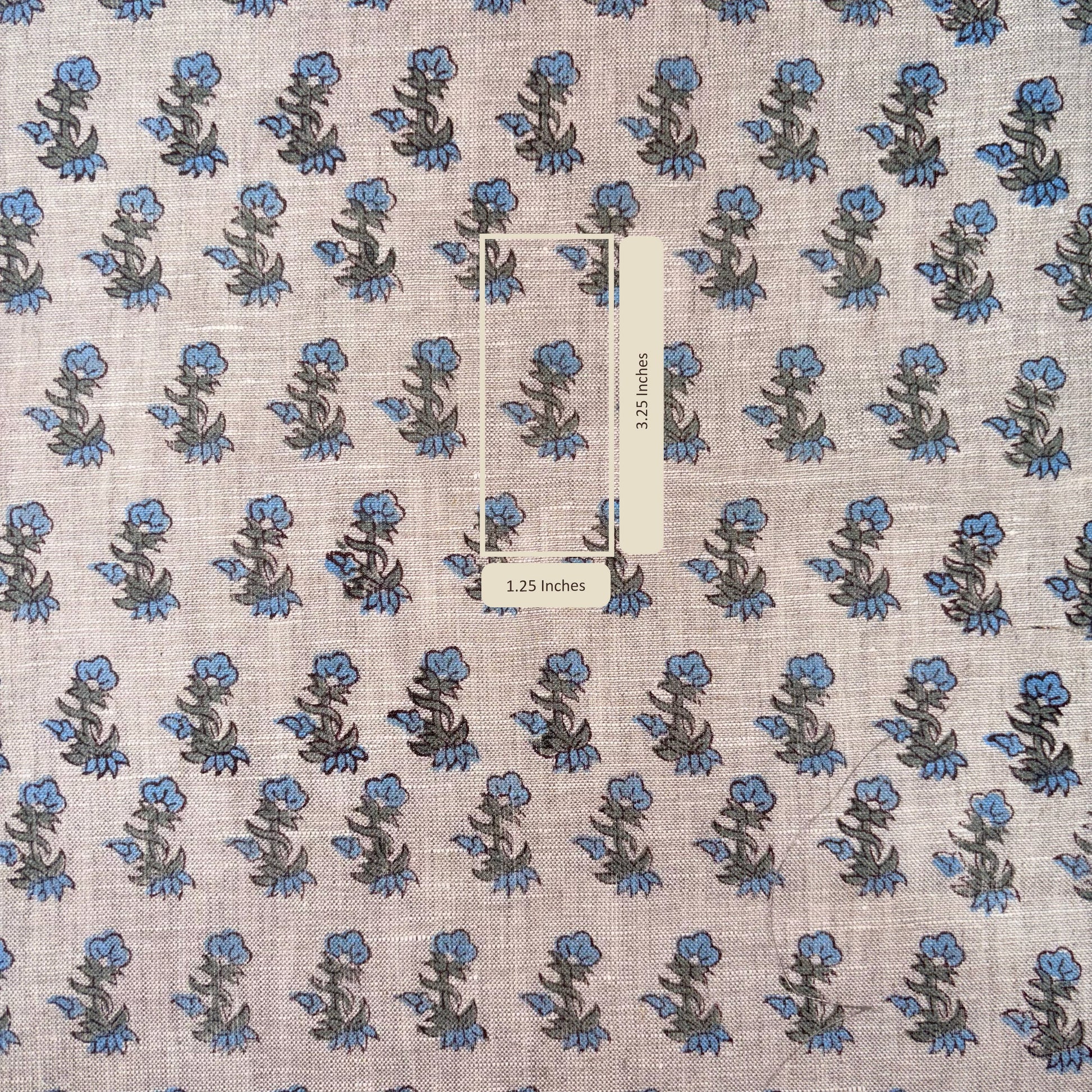 Floral patterned fabric with a scale bar indicating measurements.
