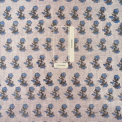 Floral patterned fabric with a scale bar indicating measurements.