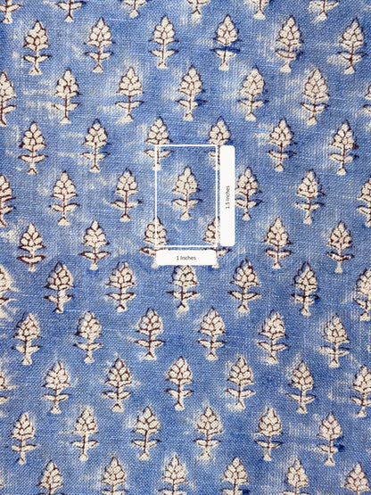 Blue fabric with white floral pattern with measurement scale