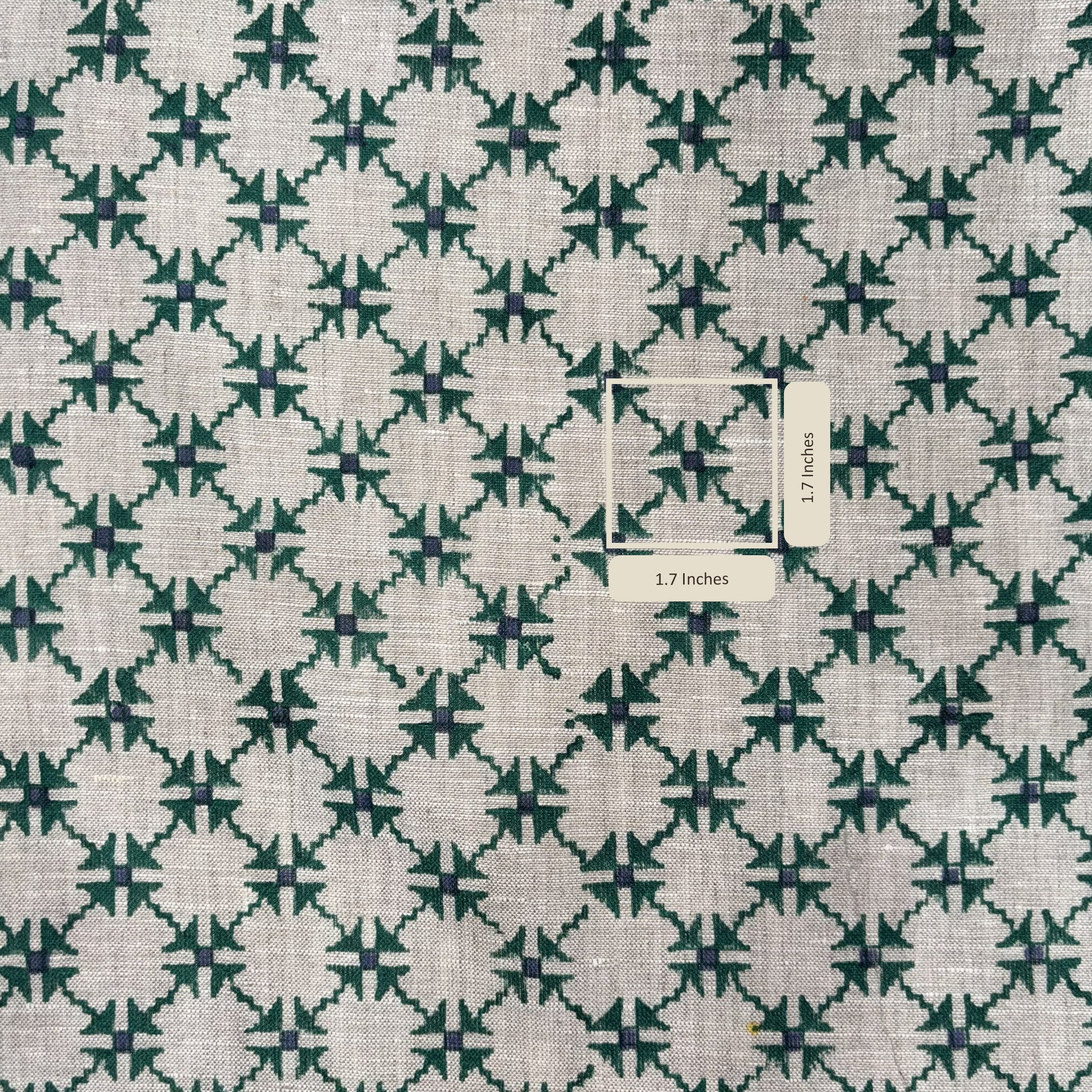 Fabric with a green and white geometric pattern and a label indicating dimensions.