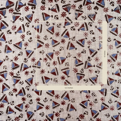 Nautical pattern fabric with anchors, stars, and triangles on a grey background
