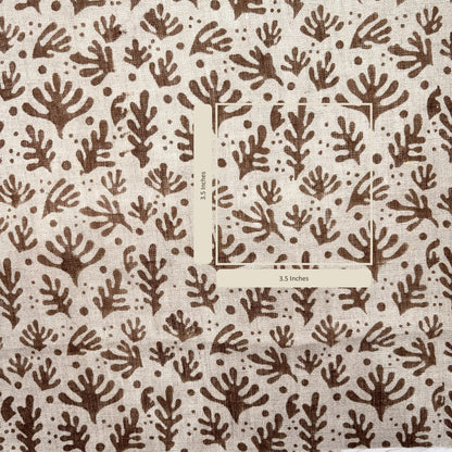 Brown leaf pattern on beige fabric with a measurement inset.