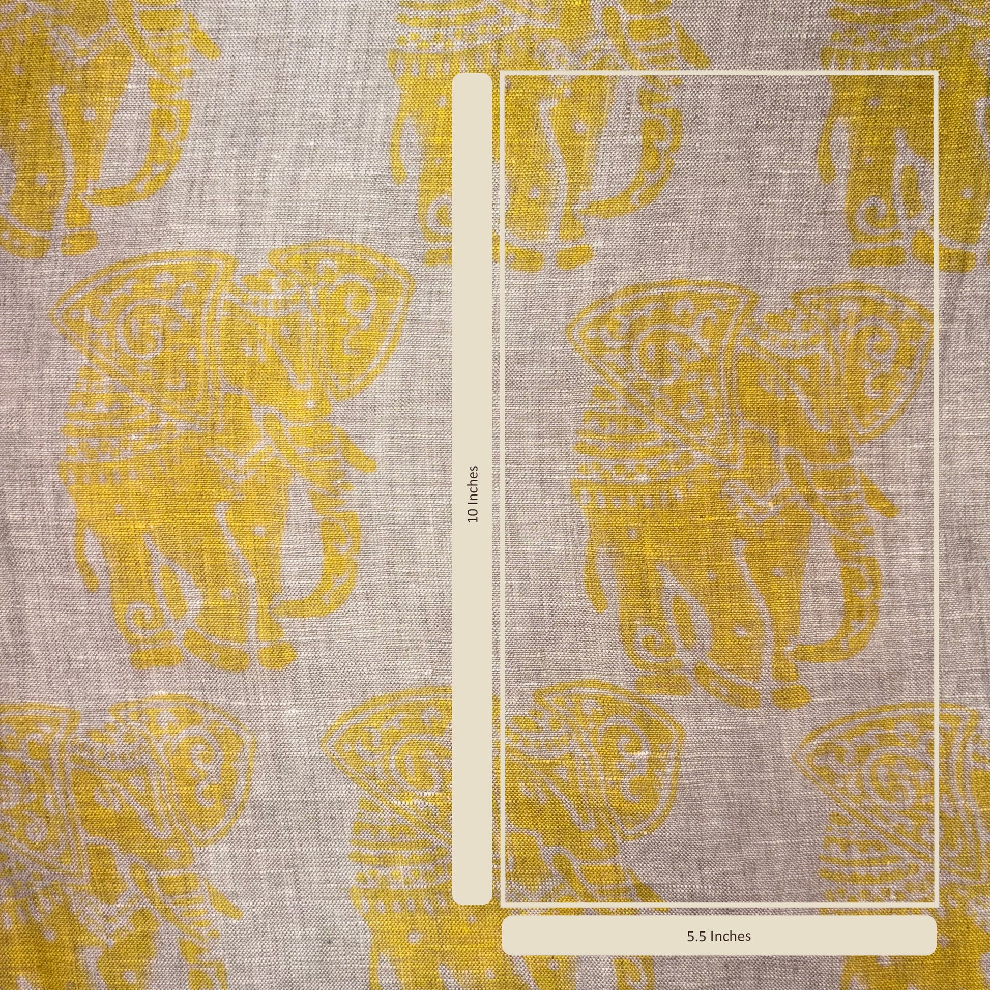 Fabric with yellow elephant pattern and a ruler for scale on a gray background