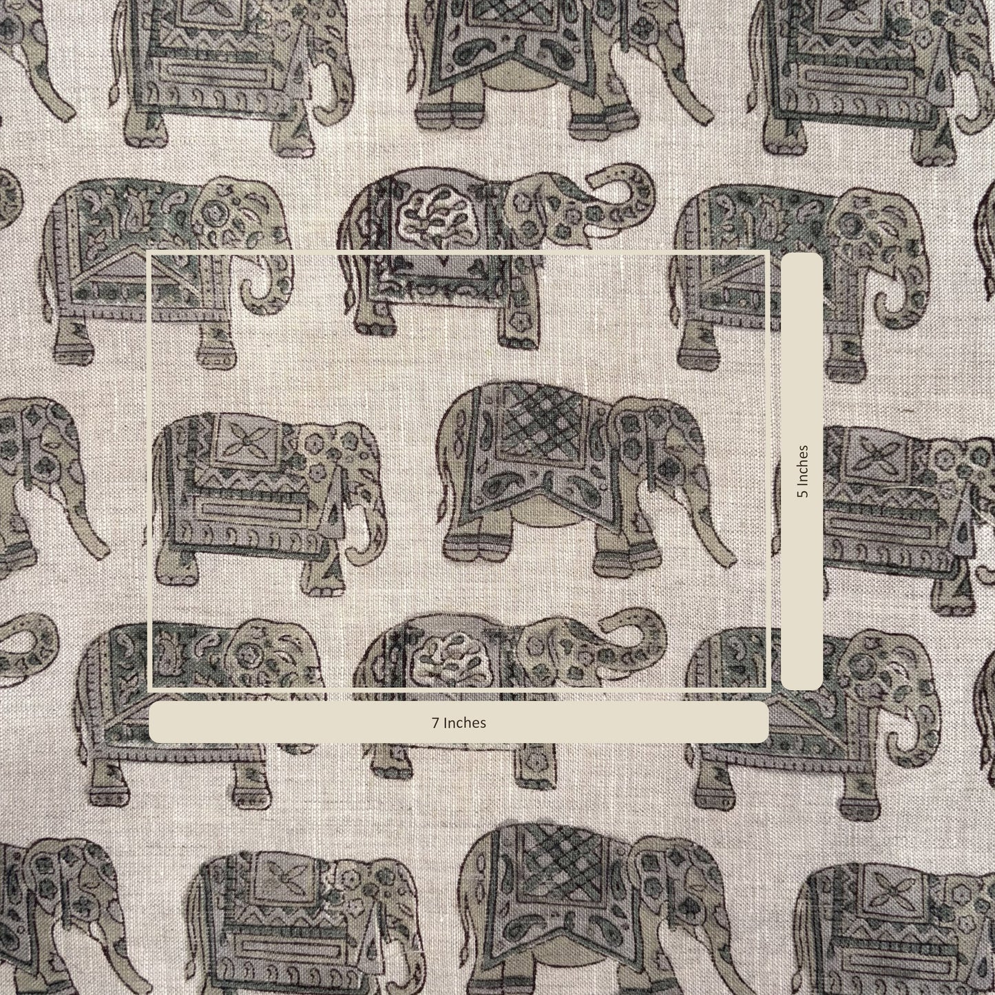 Pattern of decorative elephants on a fabric background with a measurement label.