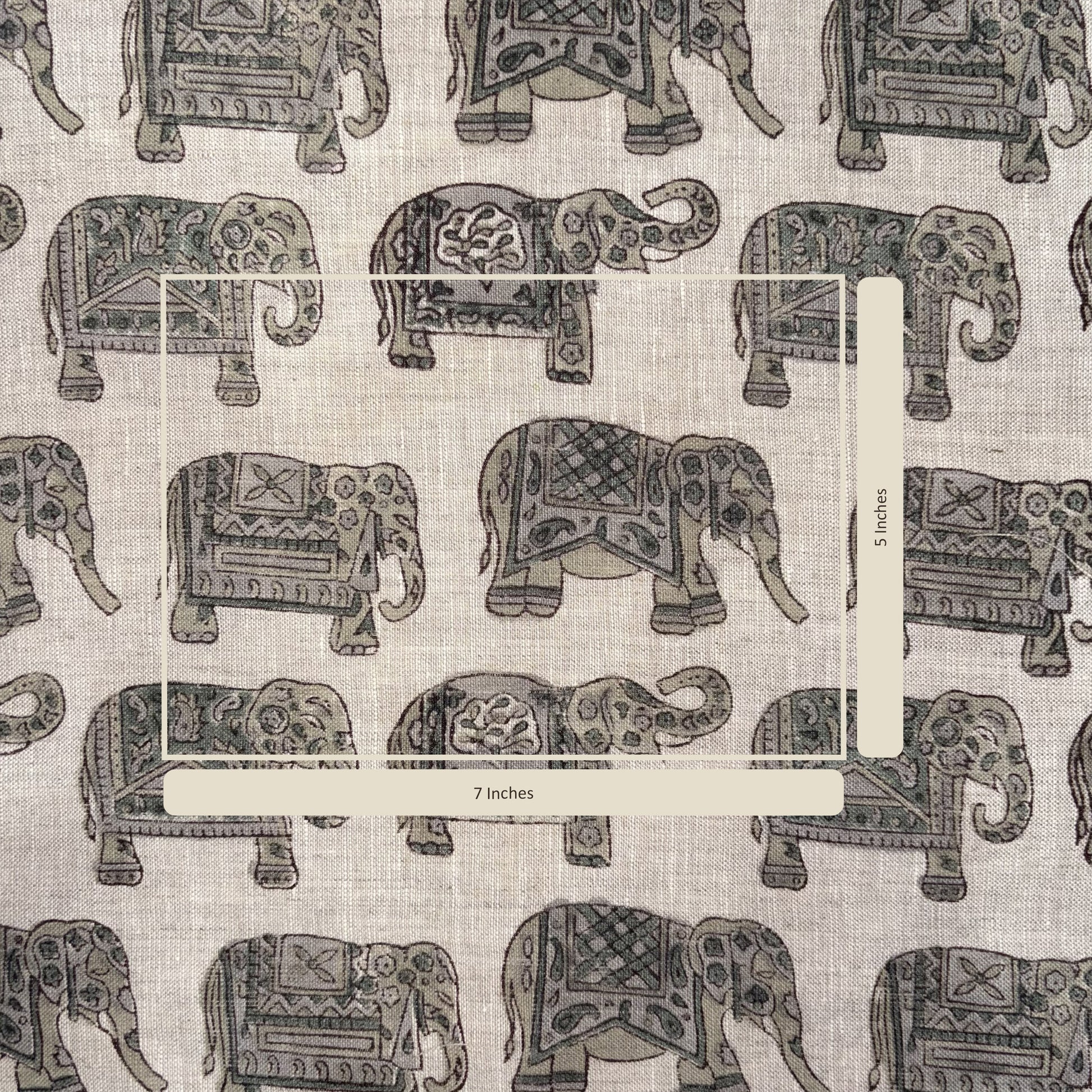 Pattern of decorative elephants on a fabric background with a measurement label.