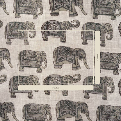 Pattern of decorative elephants on a fabric background with a measurement label.