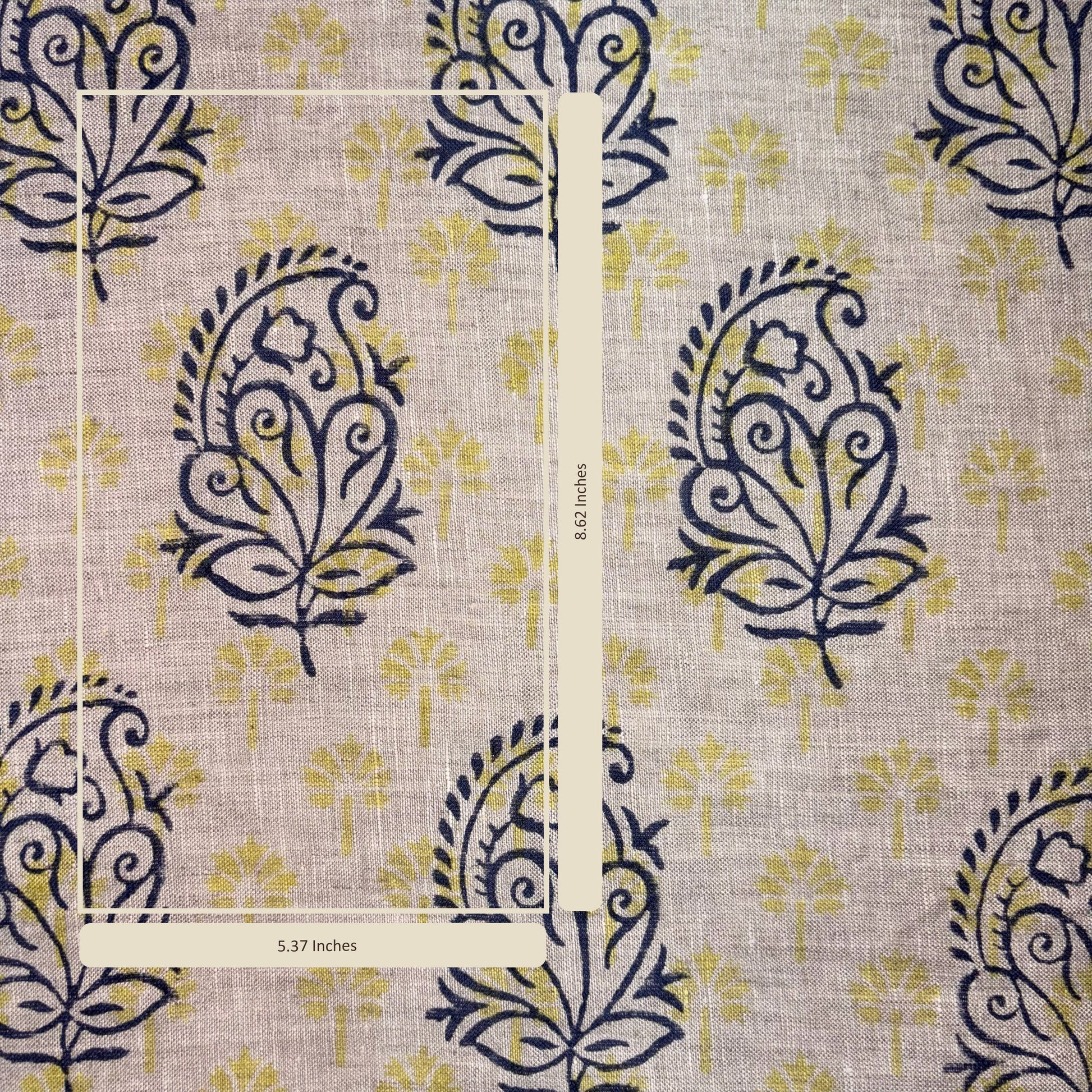 Patterned fabric with blue and yellow design on a grey background