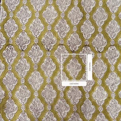 Patterned fabric with a diamond design on a green background, featuring an inset measuring 2.62 inches.