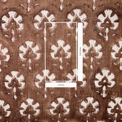 Brown fabric with white floral pattern and measurement scale