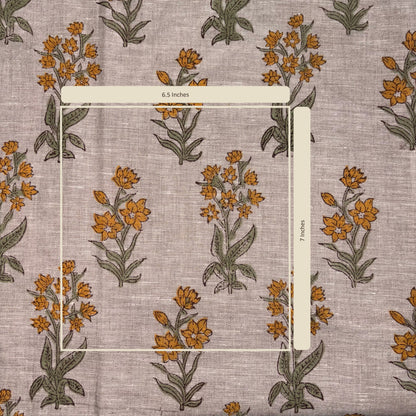 Floral patterned fabric with a ruler for scale on a matching background